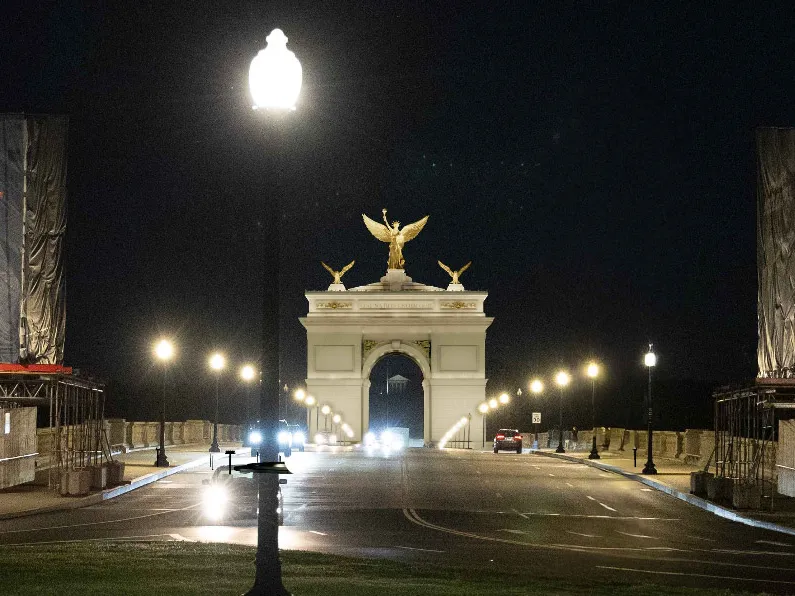 An image from Harrison Design, the studio involved in the 250-foot-tall arch project, shows what the arch could look like at night, framing Robert E. Lee's house behind it.