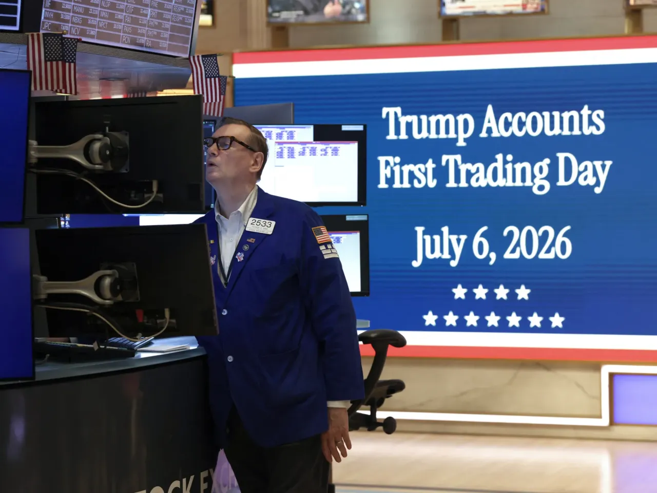 A trader moments before US President Donald Trump rings the opening bell of the New York Stock Exchange (NYSE) in New York on July 6, 2026 from the Oval Office in celebration of the First Day of trading of Trump Accounts