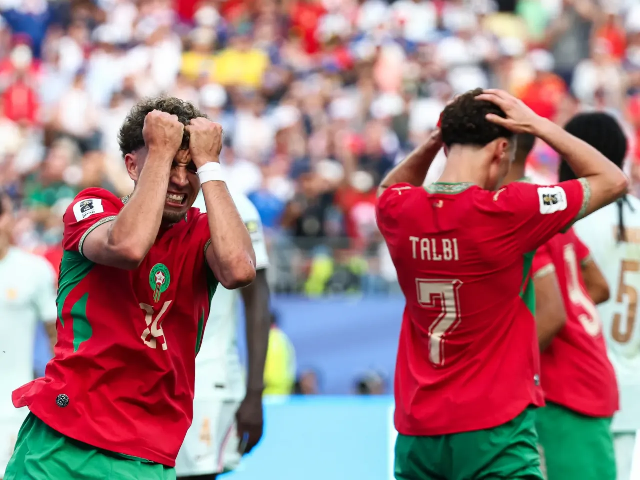 France downs Morocco 2-0 to advance to the World Cup semifinal 1 Morocco's midfielder Neil El Aynaoui (left) reacts to a missed chance during the World Cup match against France.