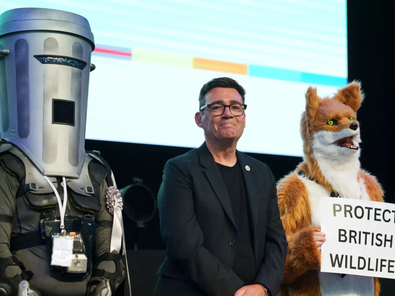 Labour's Andy Burnham stands with Count Binface and a Protect British Wildlife candidate after winning the Makerfield by-election, boosting his bid to become the UK's next prime minister, June 19, 2026.
