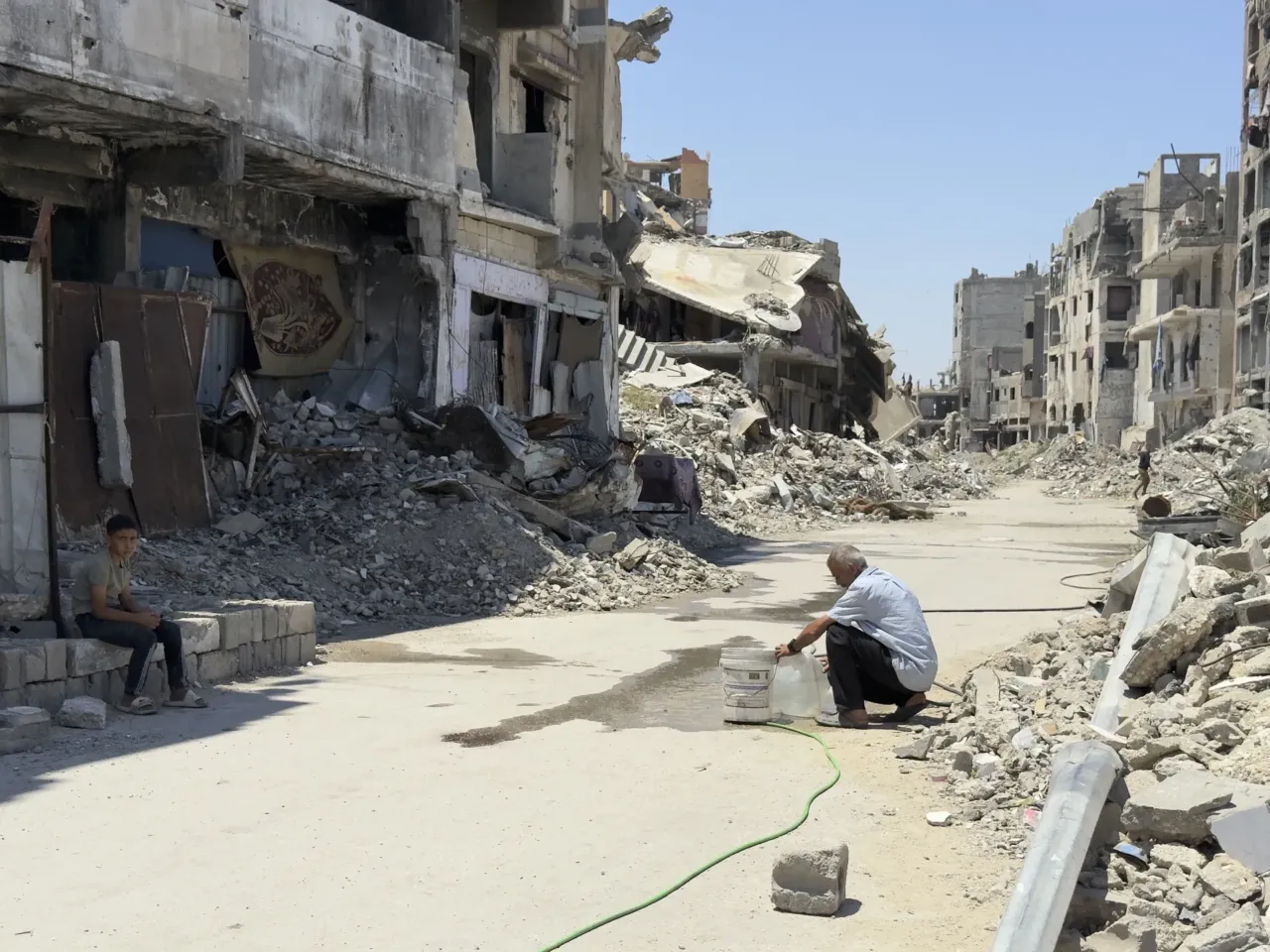 9 months into a ceasefire, Israel now controls nearly 70% of Gaza 6 A man fills a jug from from a rigged waterline in al-Shujaiya, but the nearest source of potable drinking water is 30 minutes away.