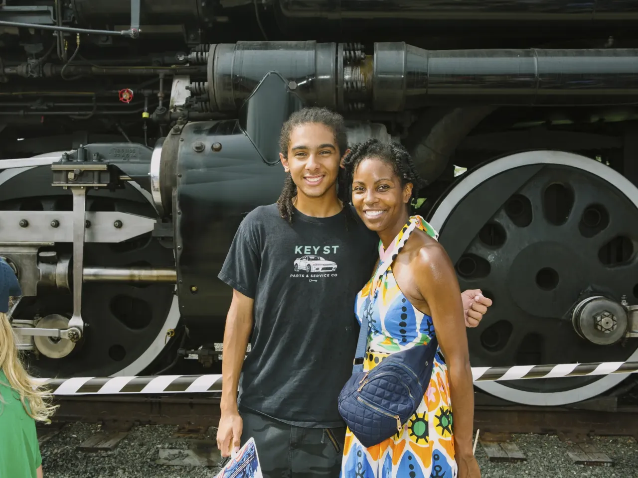 The biggest steam locomotive is whistle-stopping across the U.S. 3 Train enthusiast Brandon Westerfield, 15, stands for a portrait with his mom, Alethea Westerfield, 47, in front of Union Pacific's Big Boy No. 4014.
