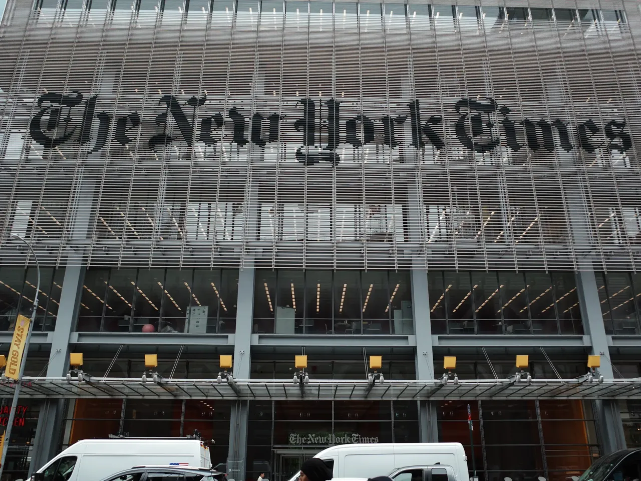 The New York Times says federal agents showed up at several of its journalists' homes Friday night to try to force them to testify before a grand jury next week.