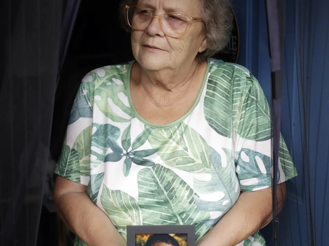 Cindy Leachman Aldridge holds a boyhood photo of her late grandson, Jonah Neal, at her home in Owensboro, Ky.