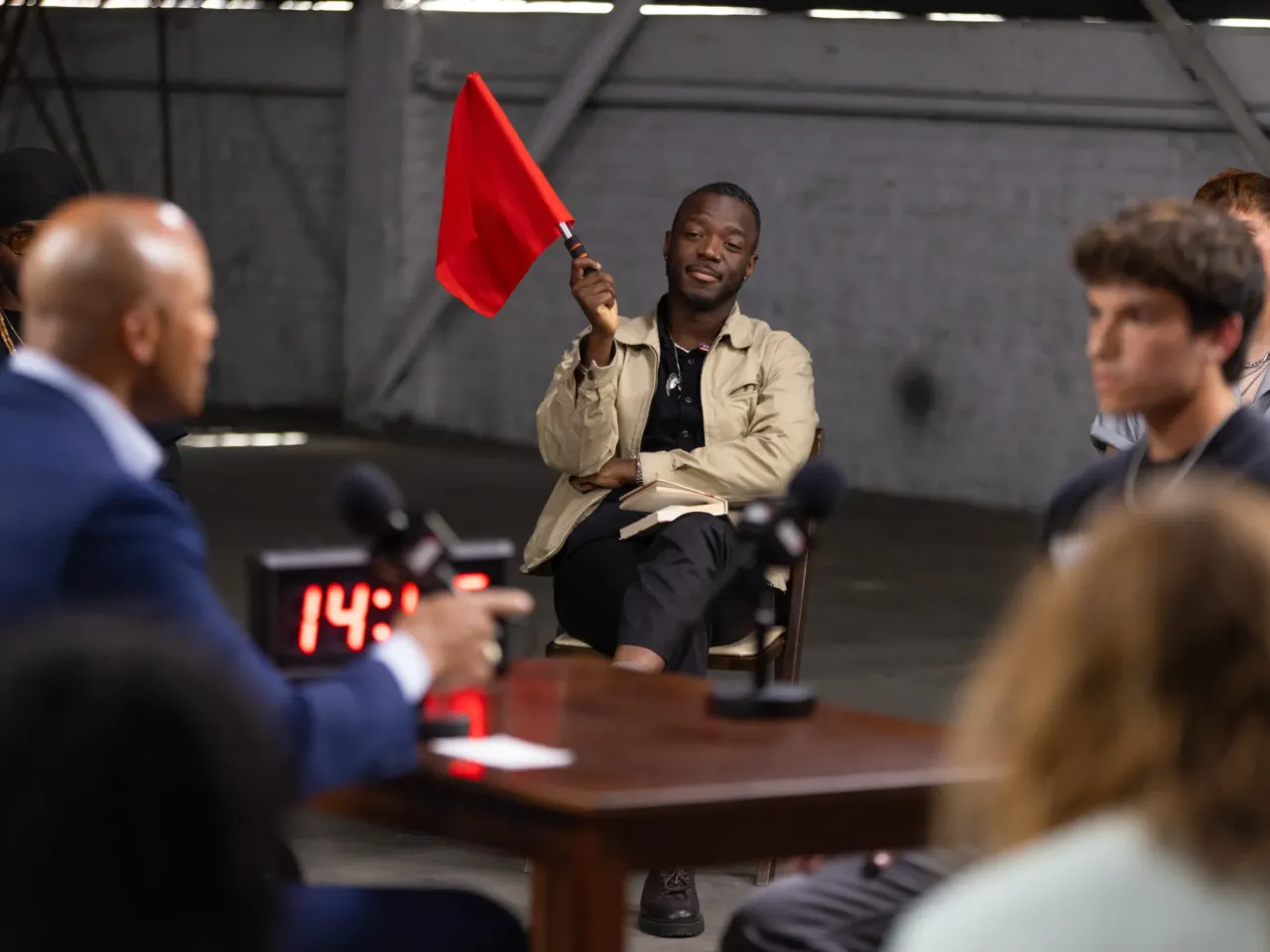 To win over young voters, some politicians are trying a new approach: debating them 1 In his appearance on "Surrounded," Moore debated everything from voters' frustration with the current political system to whether voting is any more effective at bringing change than staying home or protesting.