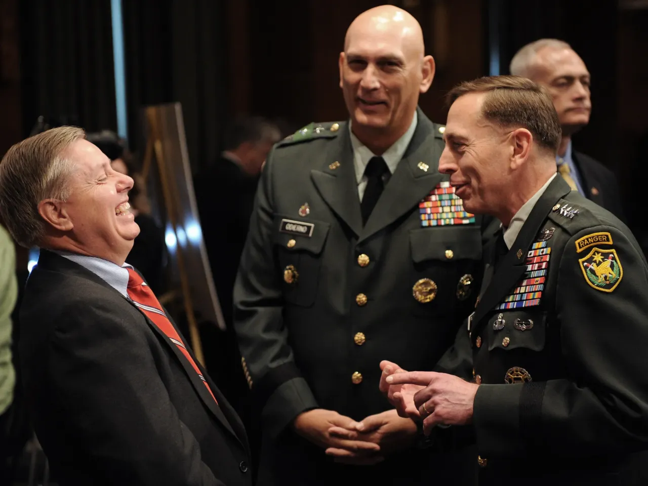 General David Petraeus (right) talked with Graham prior to the start of a 2008 hearing on Capitol Hill. Graham served under Petraeus for a brief active duty stint in Iraq.