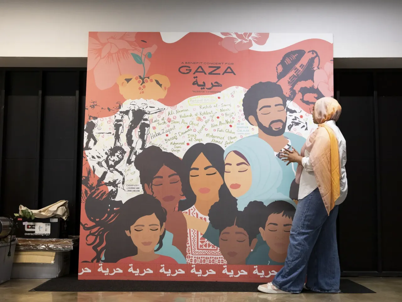 What do a bar and a Muslim community organization have in common? 10 Jannah Sellars, the creative and cultural organizing manager at IMAN, shows a piece of art by Shirien Damra made for a Gaza benefit concert, now displayed in the Arts Lounge in the organization's headquarters.