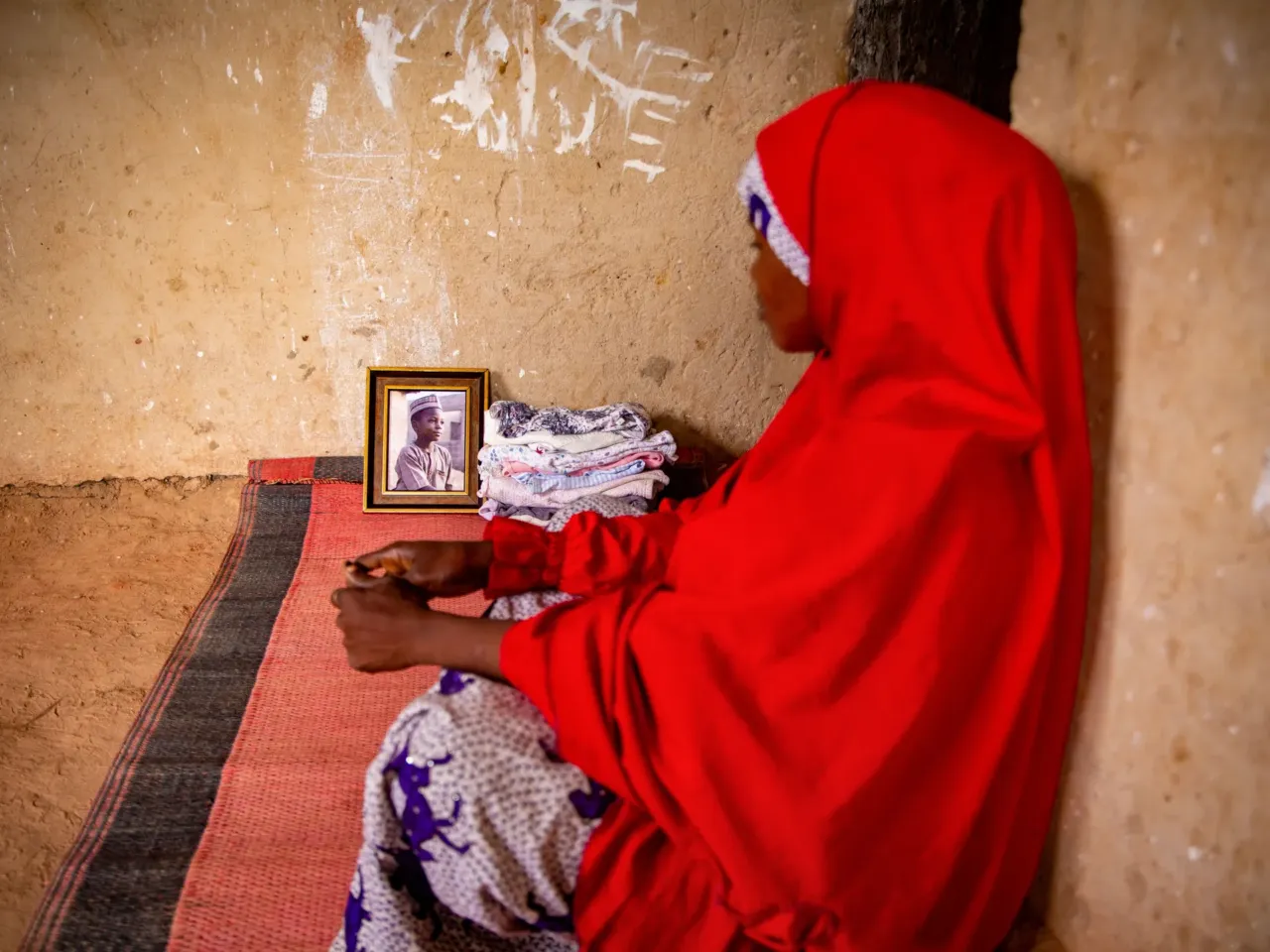 Trump's team says 'no children' died from USAID cuts. Consider these 3 cases 1 Fatima Ibrahim sits alongside a portrait of her son, Abdullahi, in the family's one-room home in Sabon Gari, Nigeria.