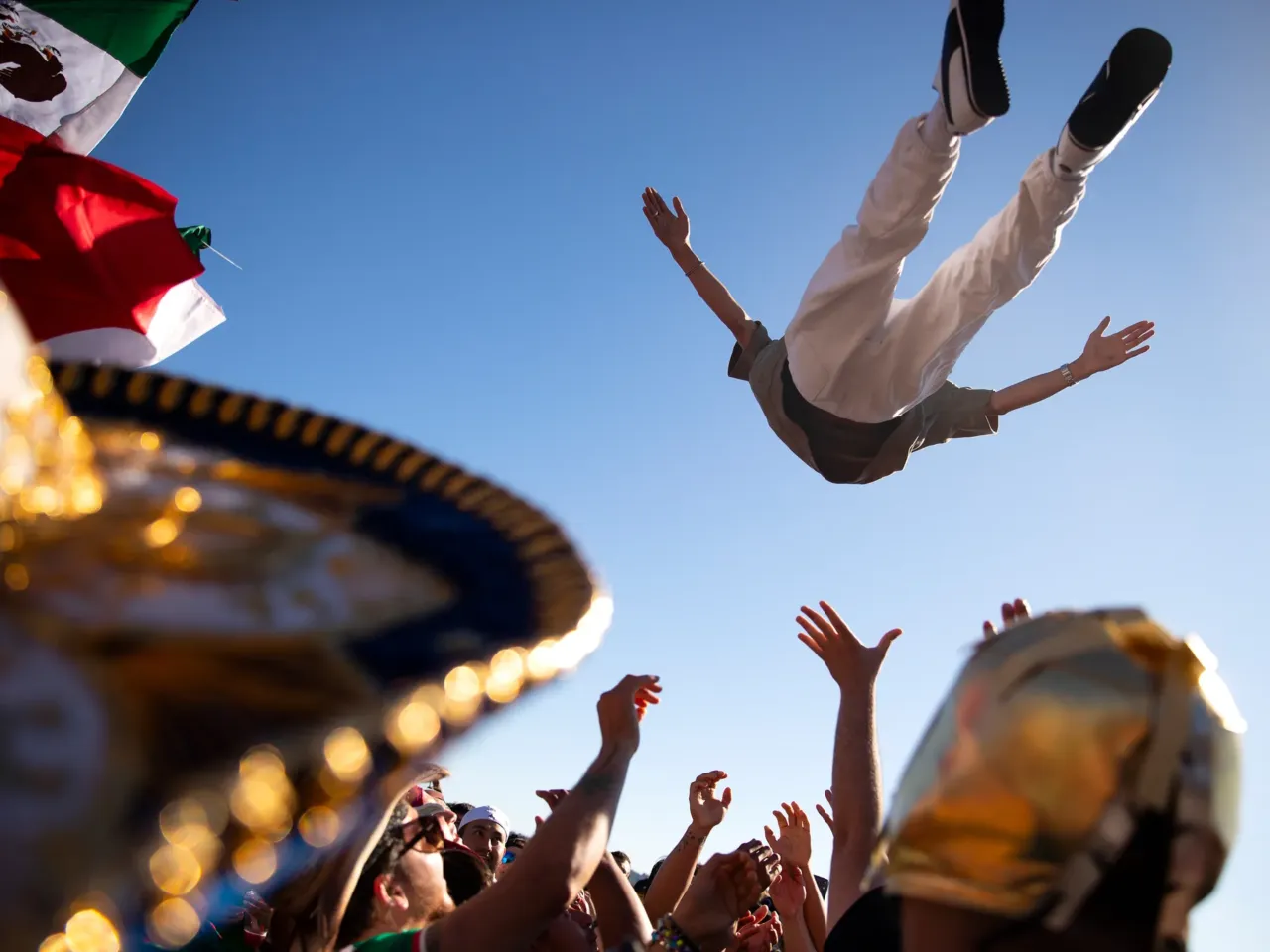 Photos: When the World Cup came to town 5 Soccer fans rooting for Mexico are launched into the air in celebration ahead of the FIFA World Cup knockout round match against England on Sunday, July 5, along the waterfront in Seattle.