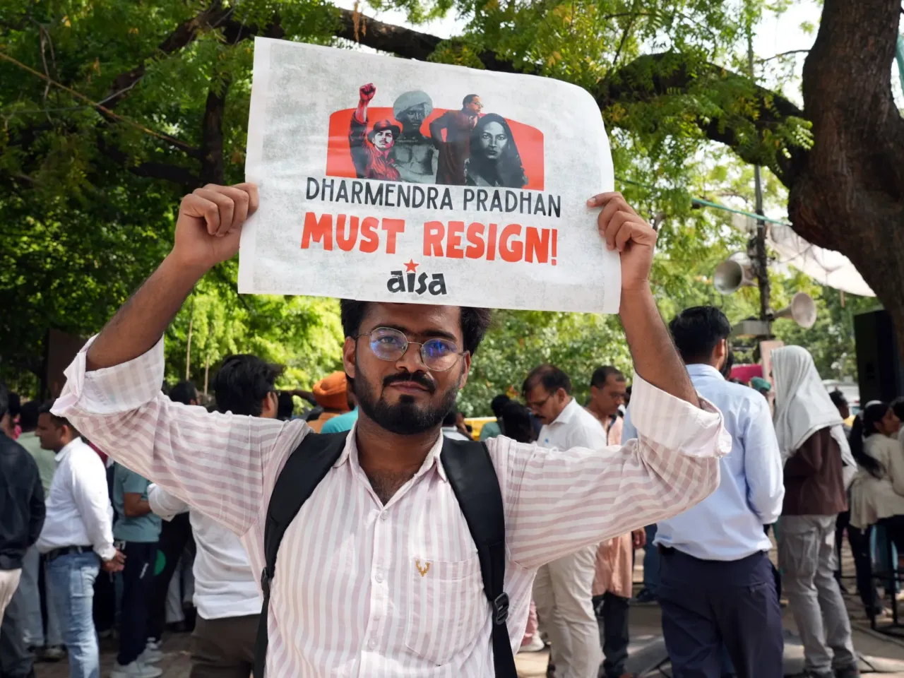 India's Gen Z 'Cockroach People's Party' started as satire but is serious about change 5 Mohammad Arshad holds a sign during the protest at Jantar Mantar on June 25, in New Delhi.