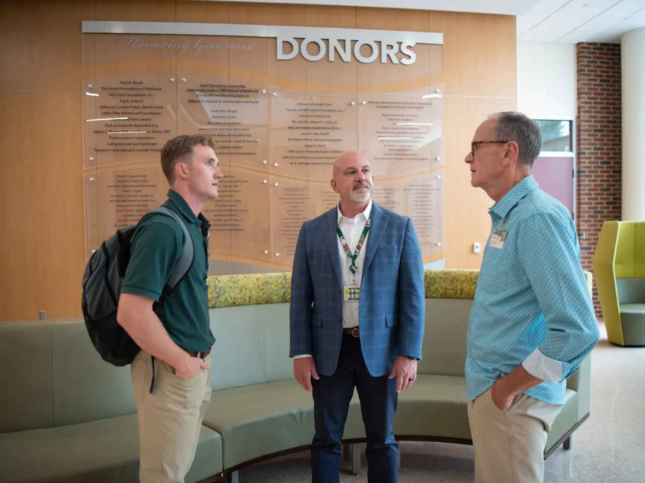 Nursing student Connor Aderholt speaks with professors Curry Bordelon (center) and Gregory Eagerton (right). Bordelon believes increasing the share of male nurses will lead to better health outcomes for men. "Patients respond when they see people caring for them that look like them," he says.