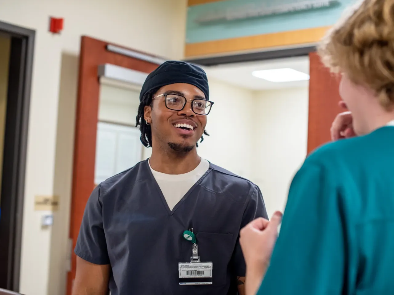 Nursing student Amiri Saadiq (left) talks with classmate Ethan Stinson in the simulation suite at the University of Alabama at Birmingham School of Nursing. Through clinical rotations, Saadiq has found that the work suits his disposition. "I think I'm pretty personable for the most part," he says.