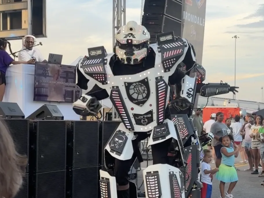 A town renamed its festival 'AI Love Irondale Day.' Then came the comments 1 A dancer on stilts is dressed as a robot -- but not doing "the robot" -- at I Love Irondale Day, July 22, 2026.