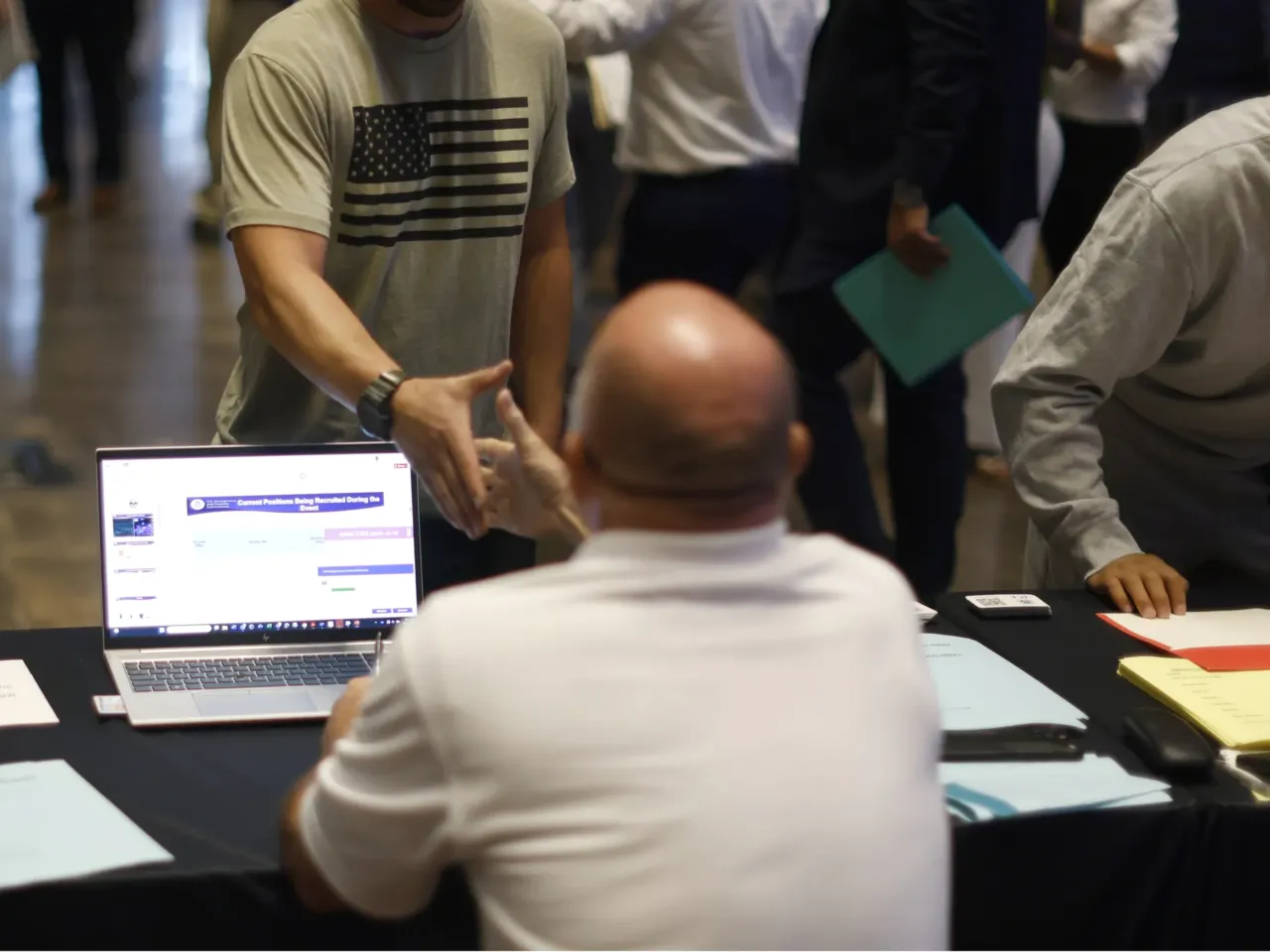 Amid a big hiring push, police experts question ICE officer vetting 1 People line up to speak with recruiters as U.S. Immigration and Customs Enforcement (ICE) holds a major hiring event on August 26, 2025 in Arlington, Texas. The federal immigration agency is ramping up recruiting efforts nationwide.