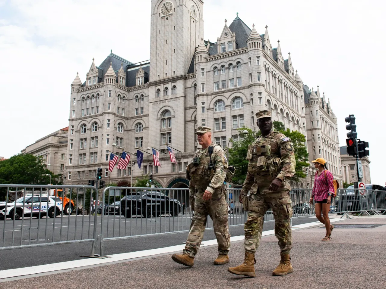 National Guard troops walk across the street from the Waldorf Astoria hotel where President Trump attended the White House Correspondents' Association Dinner, in Washington, D.C., on Friday.
