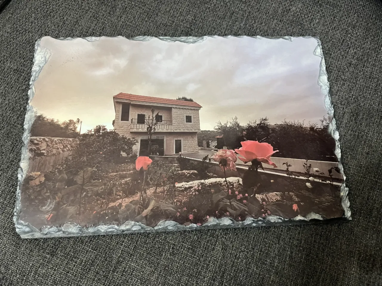 Lebanese displaced by war turn to satellites to check their homes 4 Mazen Farah mounted a photo of his family's home on a stone plaque for his 75-year-old father, who missed seeing the house after leaving Yaroun.