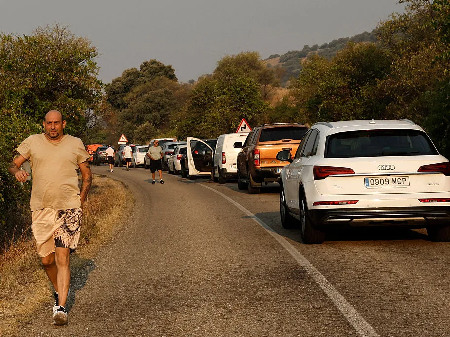 France continues to fight devastating wildfires, while progress is made in Spain 2 Drivers try to access Cenicientos, 80 kilometers southwest of Madrid, one of the villages damaged by a wildfire, on Monday.