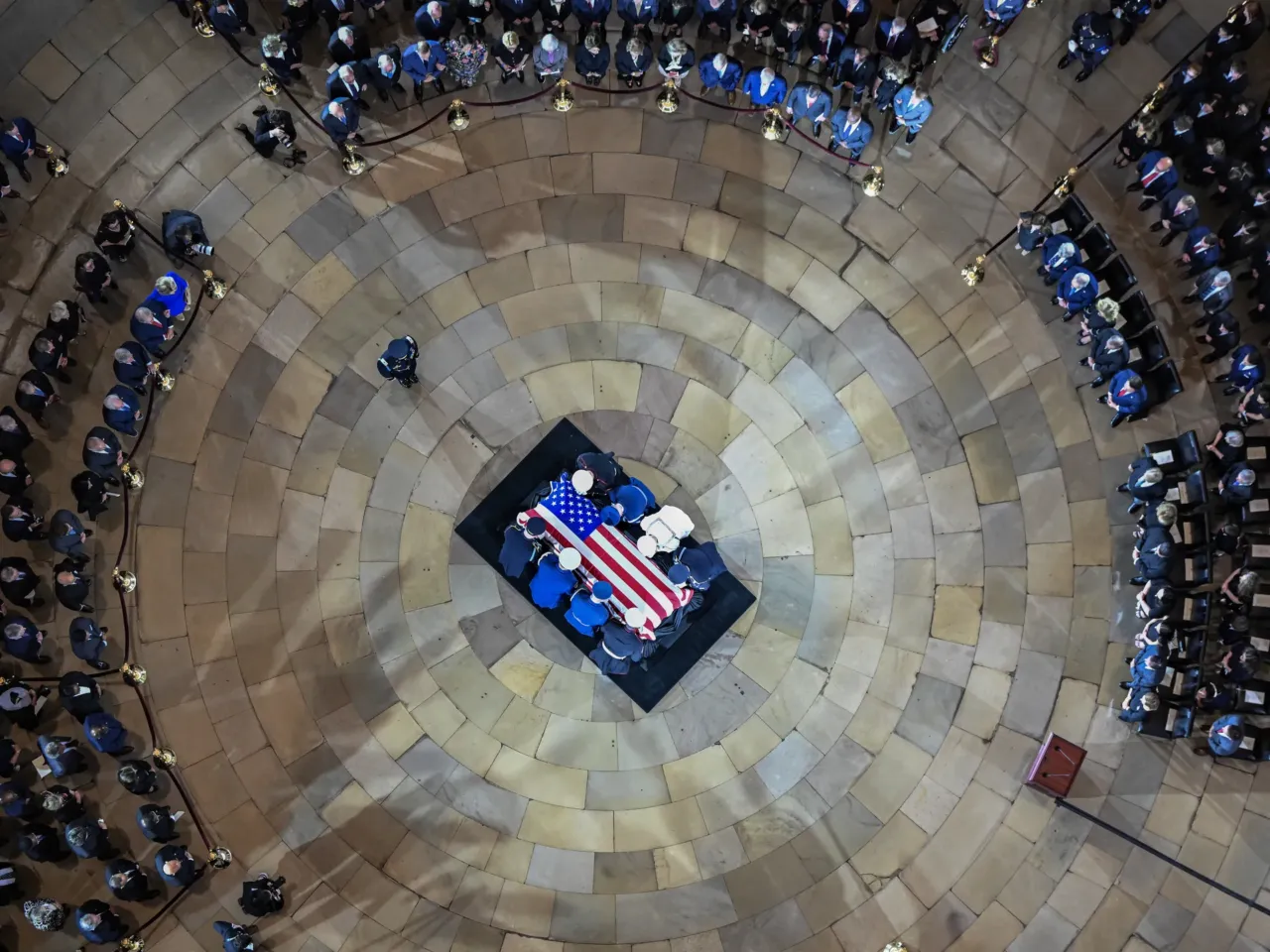An Armed Forces Body Bearer Team moves Graham's casket in the Rotunda of the U.S. Capitol.