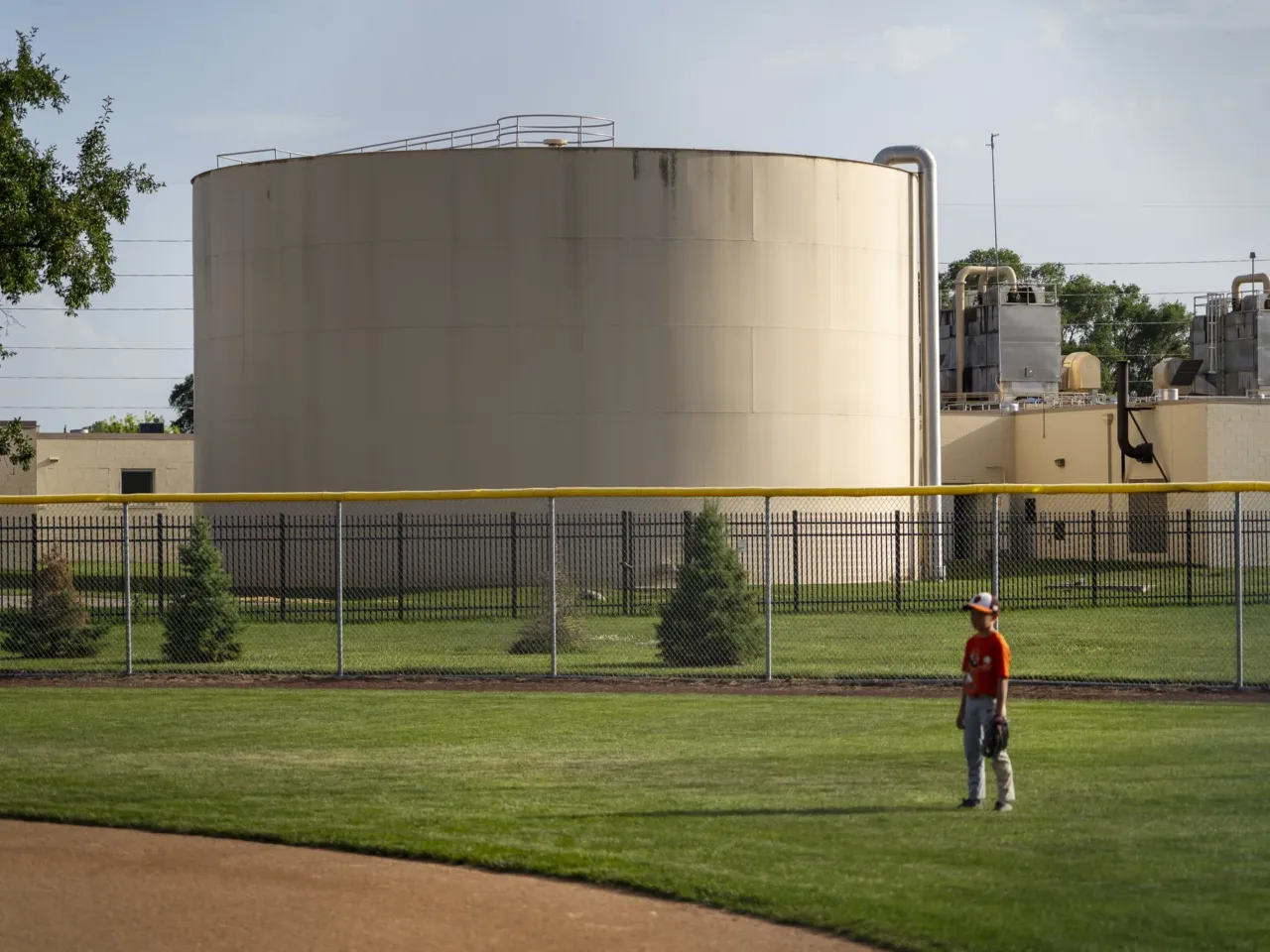 Members of a youth baseball league play a game near the A.C. Ward Water Treatment Plant in Des Moines, Iowa in June. Water quality has become an important issue for voters ahead of the 2026 gubernatorial election.