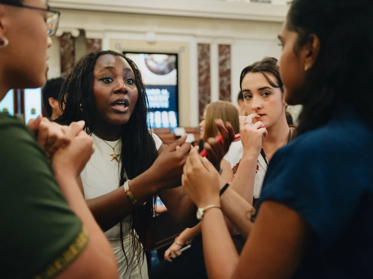 Adults have struggled to set rules for AI in school. These teens figured it out 5 In the final minutes before a key vote, student senators from (left to right) Minnesota and Washington state confer with their colleague.