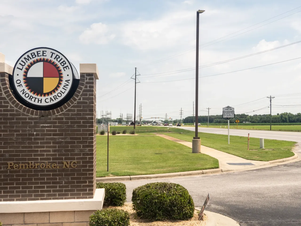 The Lumbee Tribe government offices and citizen housing in Pembroke, North Carolina, stand amid long stretches of agricultural countryside.