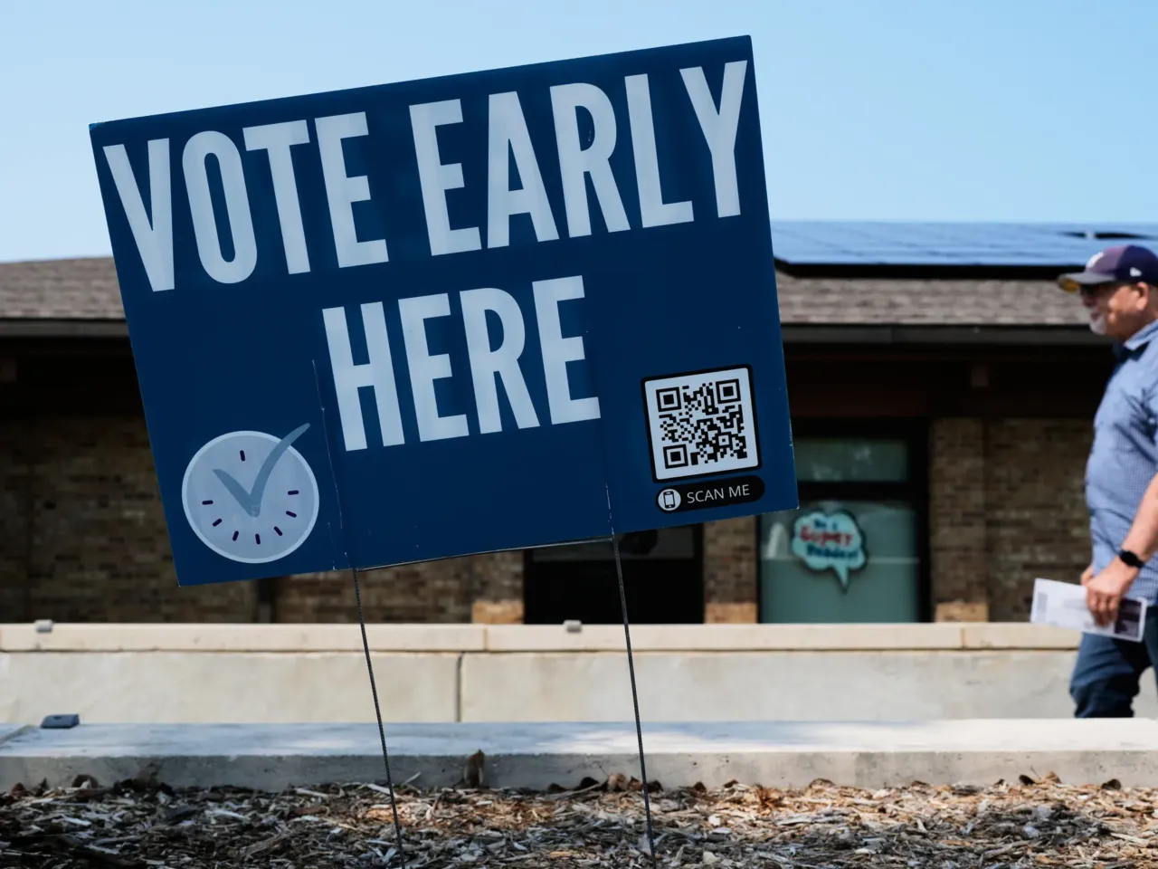 A voter walks to polling place in Milwaukee on Tuesday.
