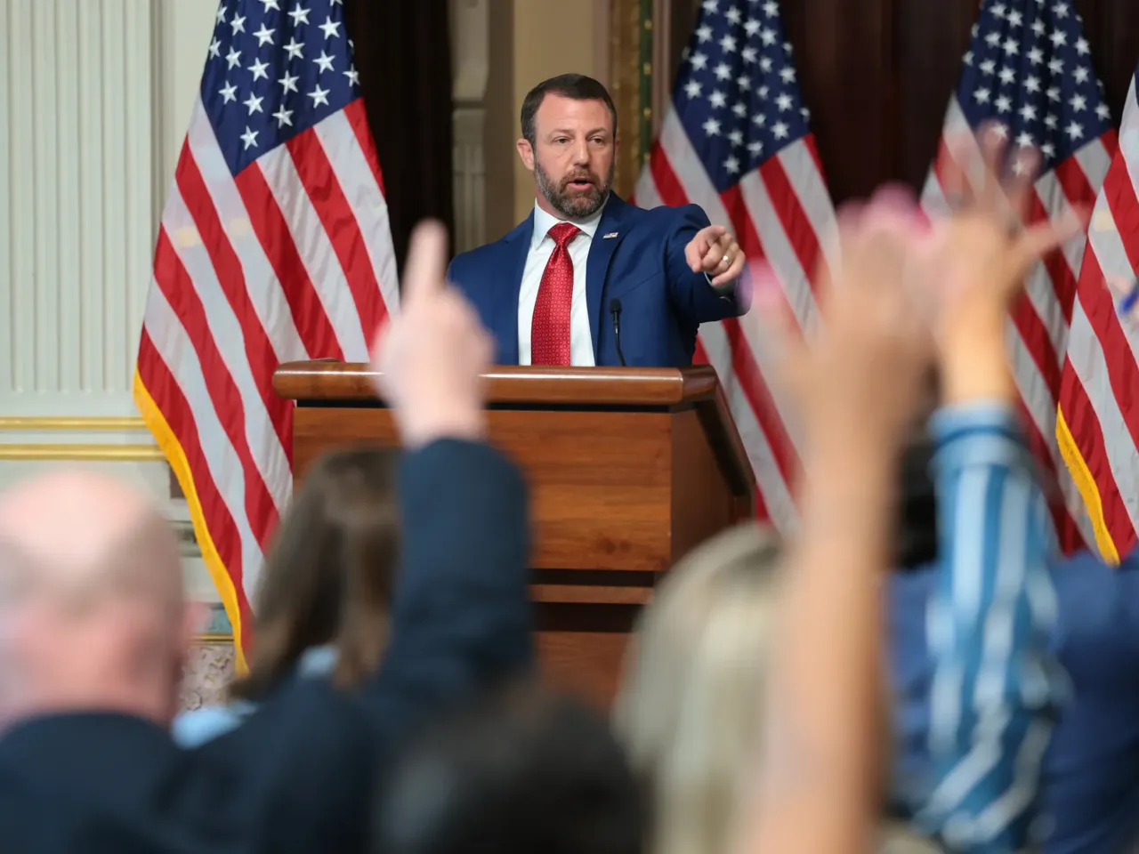 Secretary of Homeland Security Markwayne Mullin answers questions from reporters on July 17 after remarks about his agency alleging that more than 250,000 non-U.S. citizens are on the voter rolls in just four states. Those states dispute that tally.