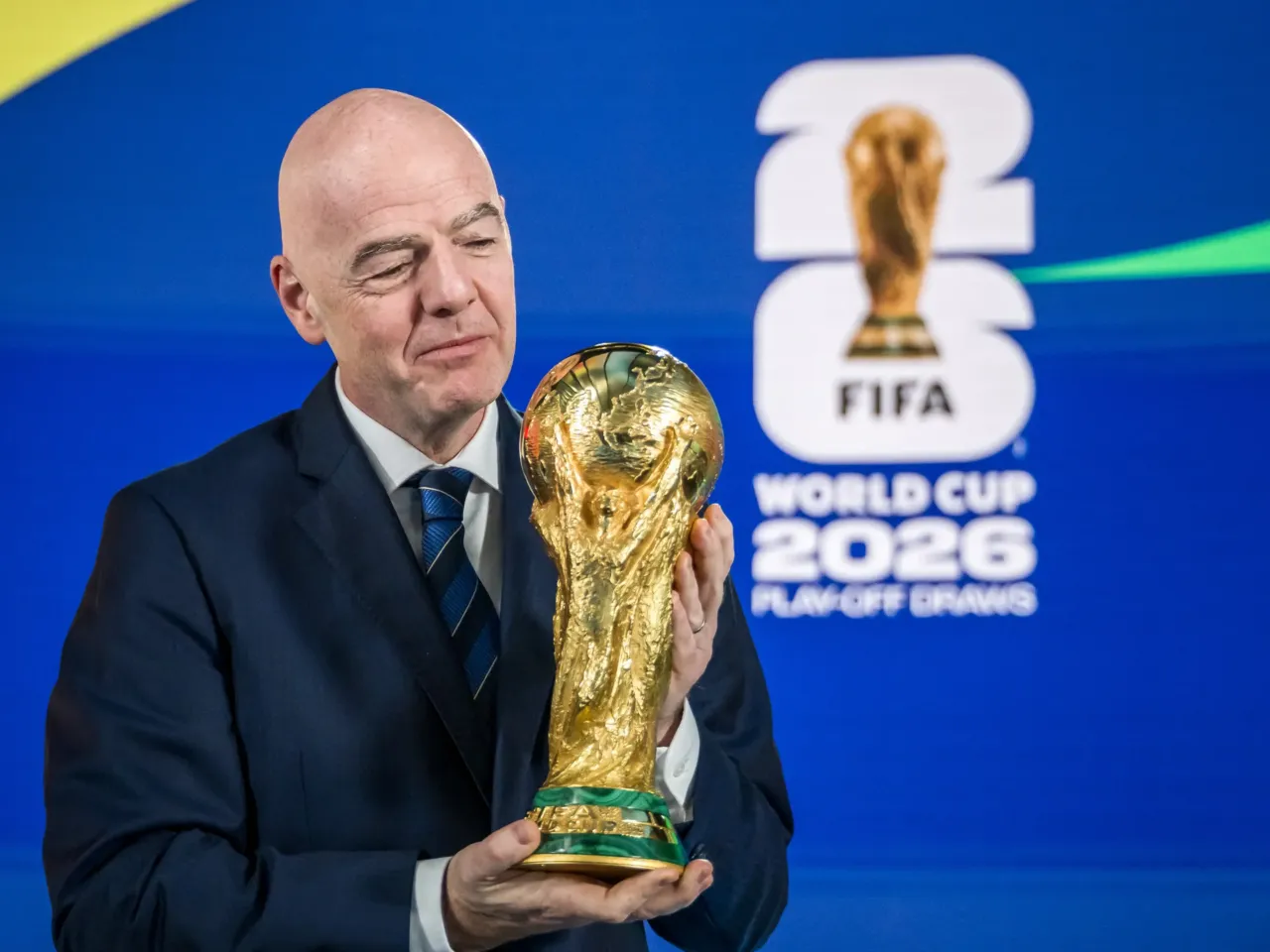 FIFA President Gianni Infantino poses with the World Cup trophy following the 2026 FIFA World Cup European Play-Off draw at the FIFA's Home of Football in Zurich on Nov. 20, 2025.