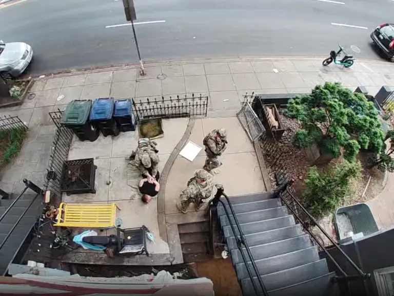 A veteran was detained by the National Guard in her front yard. Now she’s suing