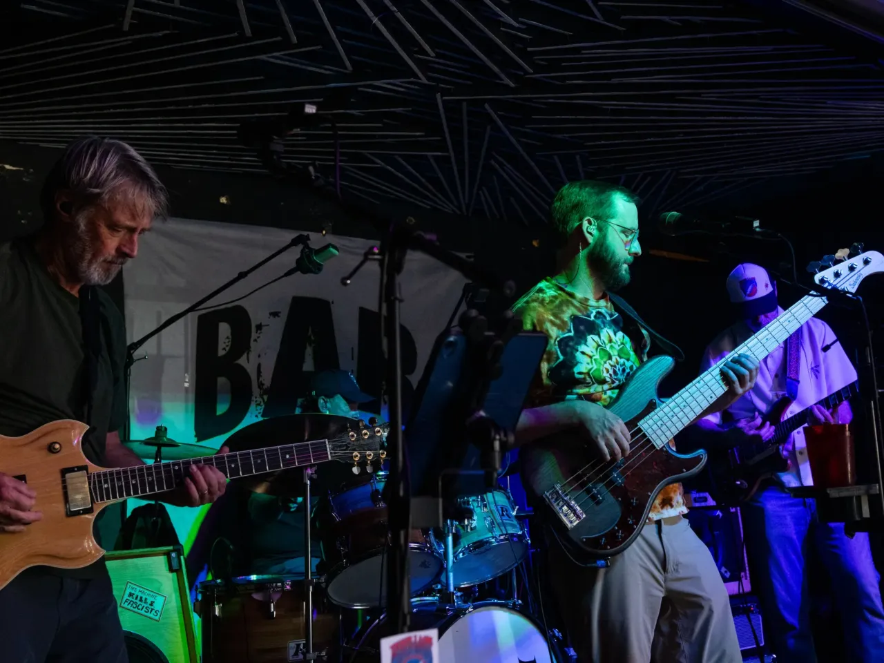 From left, Keith Stieduhar, Bryan Williams and Mark Vossler, members of Built to Last, a Grateful Dead cover band, perform on Sunday, July 19, 2026 at Bar 404 in Denver, Colorado.