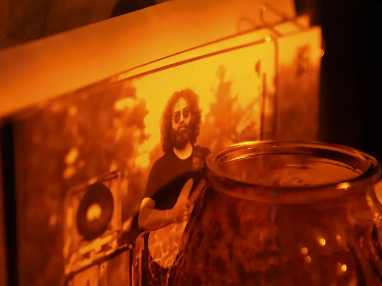 Postcards of Jerry Garcia of the Grateful Dead are seen in Garcia's music venue.