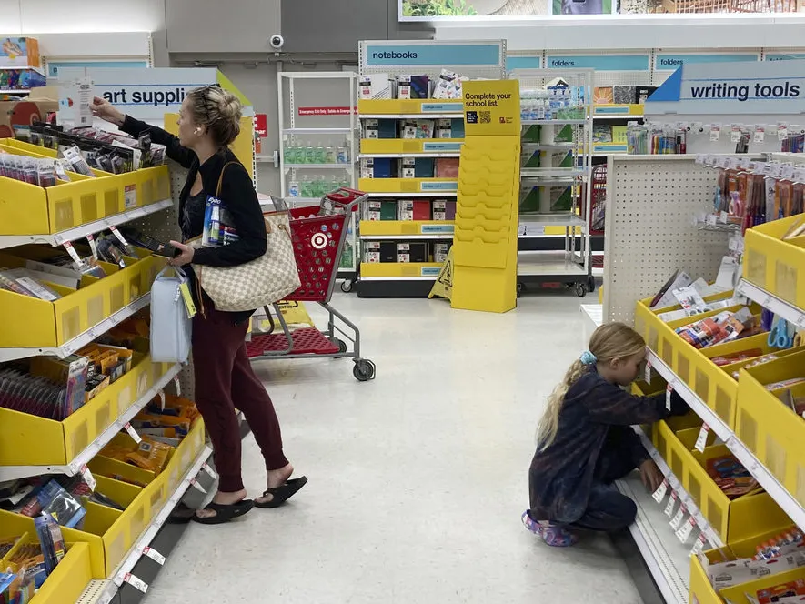 People shop for school supplies at a Target store in Miami, Fla., on July 27, 2022.