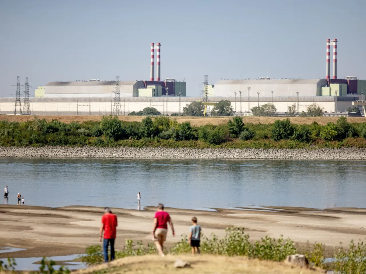 A view of Hungary's Paks Nuclear Power Plant from the Danube embankment in Dunaszentbenedek on July 31, 2026. Record-low water levels on the Danube, driven by extreme heat and drought, have threatened the plant's cooling system and highlighted Europe's worsening climate crisis.