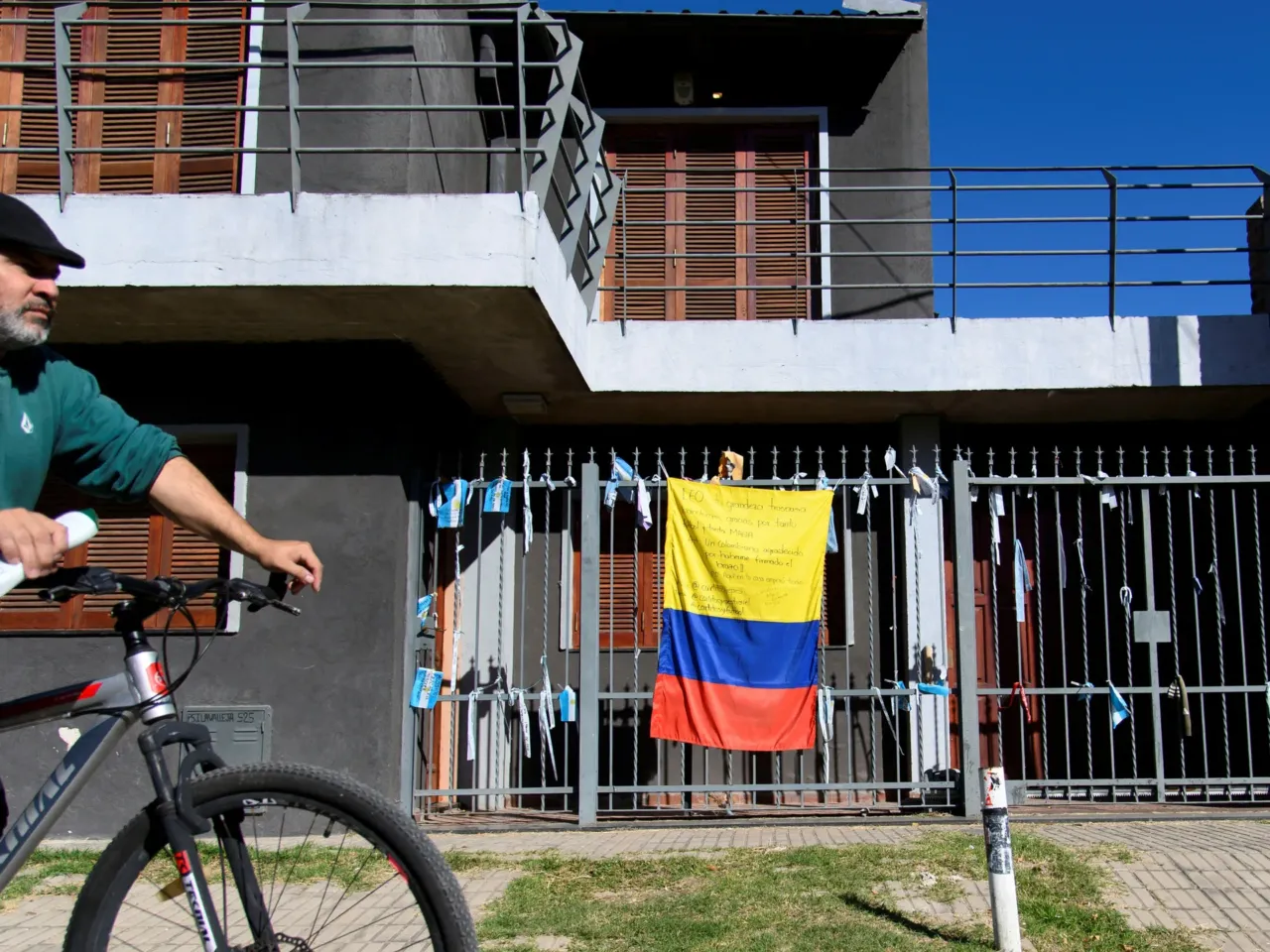 How Lionel Messi's legend is driving tourism in his hometown 1 A man on a bicycle passes in front of a house displaying a Colombian flag bearing a message of thanks to Argentine footballer Lionel Messi in his childhood neighborhood in Rosario, Santa Fe province, Argentina, in 2026.