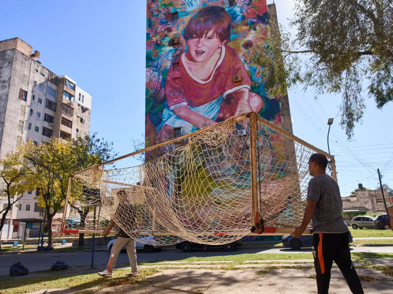 How Lionel Messi's legend is driving tourism in his hometown 2 Workers from the Grandoli football club carry a goalpost to the pitch for children's soccer matches in Rosario, Argentina, in 2026.