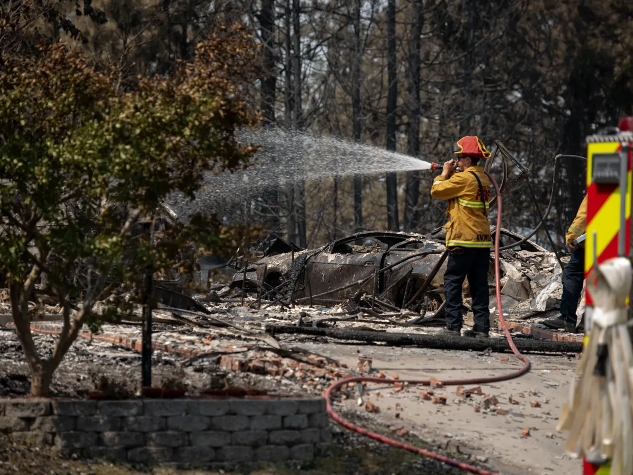 Wildfires in urban areas are more common. That may have helped Spokane 4 Firefighters visit burned homes to put out hot spots on the properties to prevent new blazes.