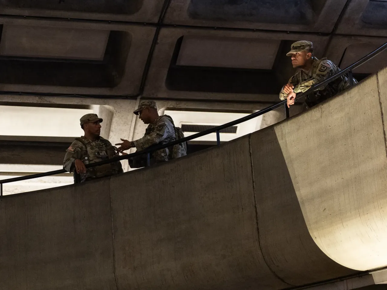 Armed troops have patrolled D.C. for 1 year now. It's challenging democratic norms 3 Members of the Army National Guard patrol Metro Center station during rush hour on July 08, 2026 in Washington, DC. The National Guard has been deployed in the city continuously for almost a year.