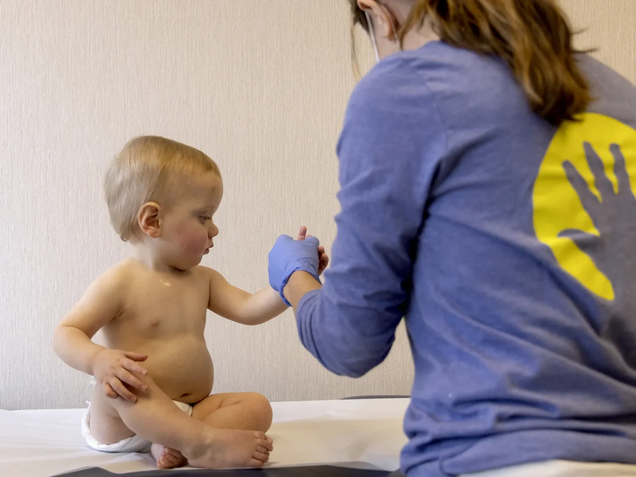 A child is prepped to receive an MMR vaccine at Lurie Children's Primary Care in Chicago.