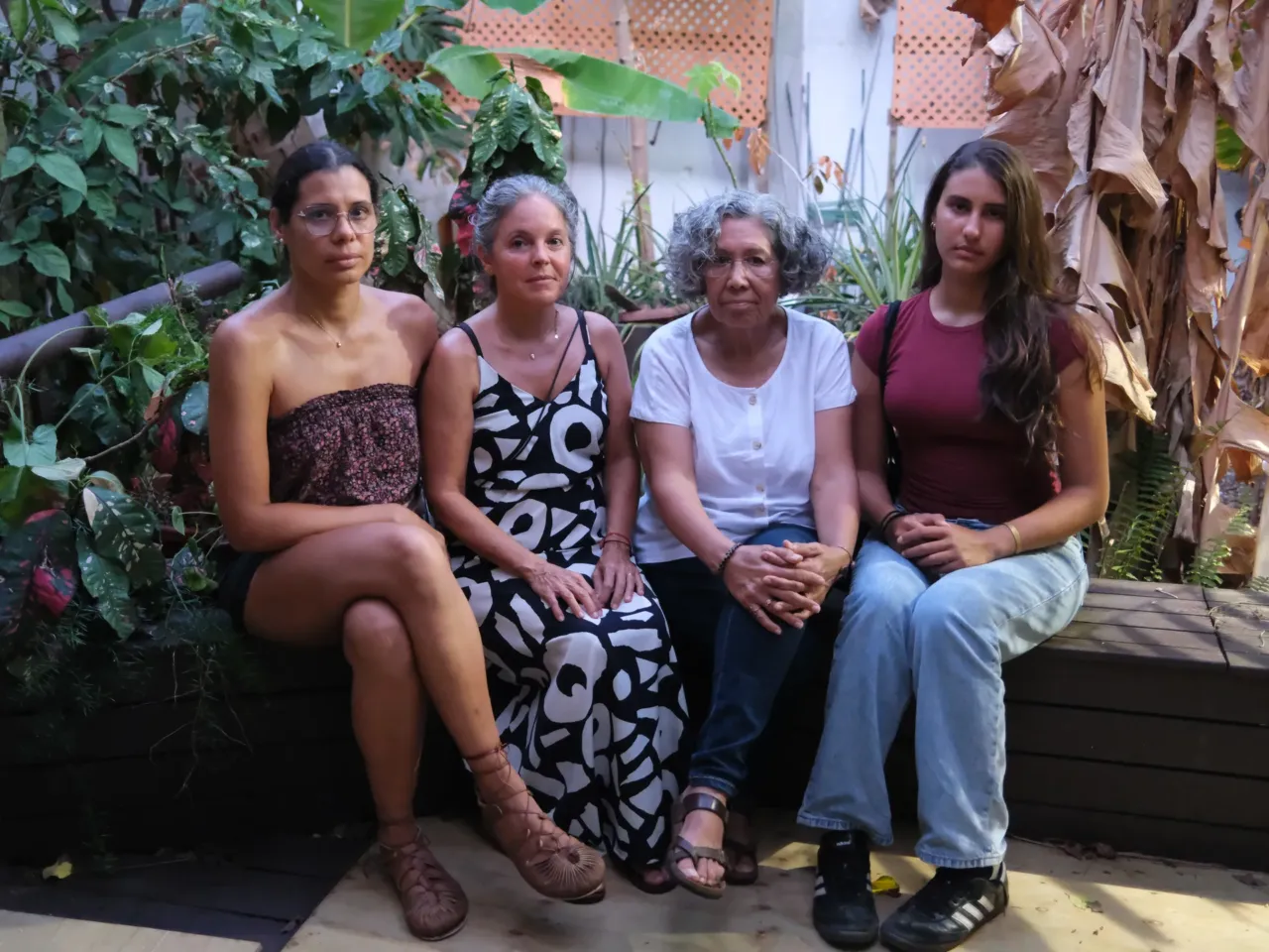 Yoamadil Cabán, Norma Peña, Sonia Palacios and Polyana Cabán — neighbors in San Juan who've had to settle into new and frustrating routines after a year of unreliable water service.